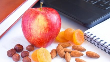 apple and nuts show the benefits of snacking for health